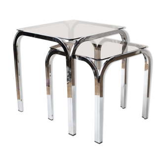 Pair of chrome nesting tables with smoked glass tops