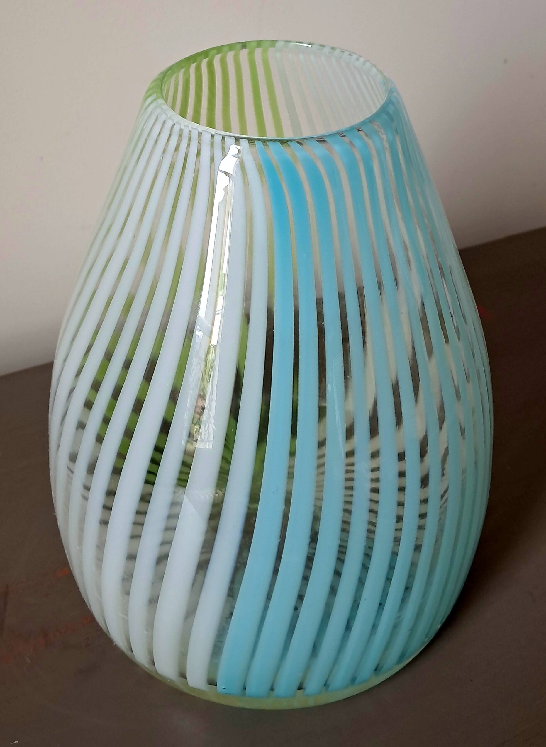 Blown glass vase with opal glass threads