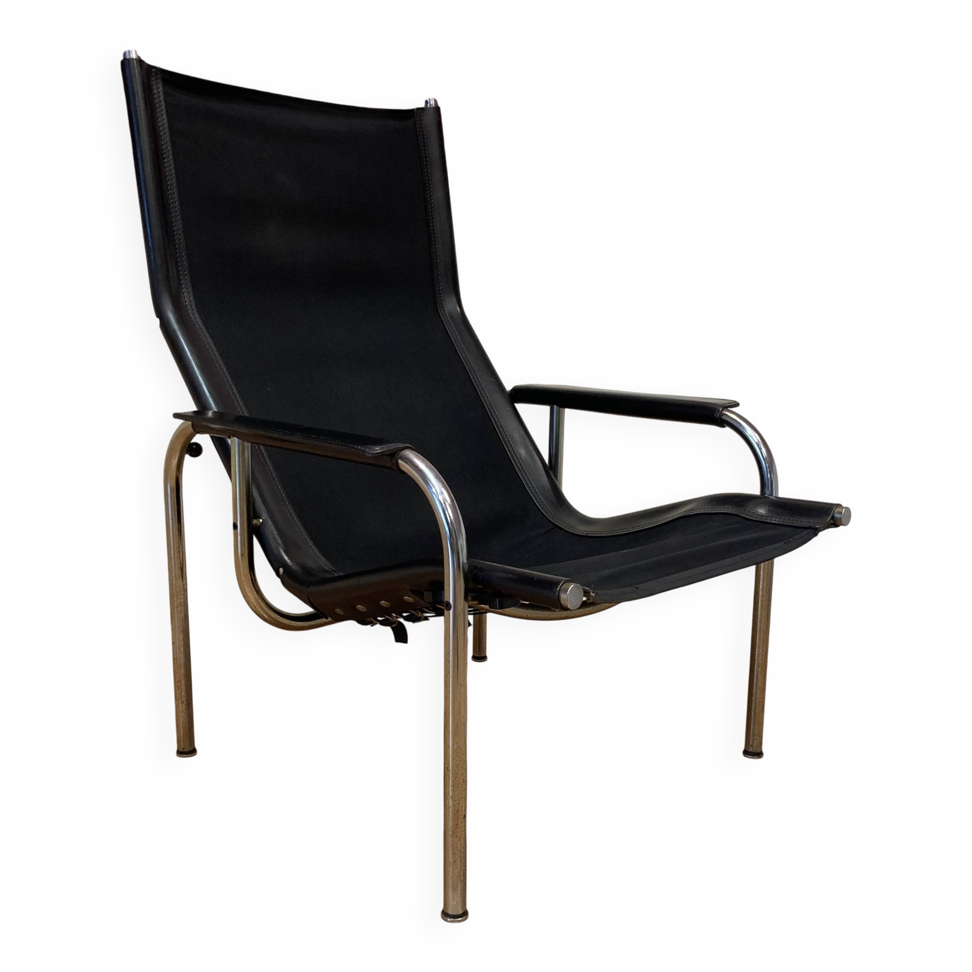 Reclining armchair in black leather and chrome design "hans eichenberger" 1960.