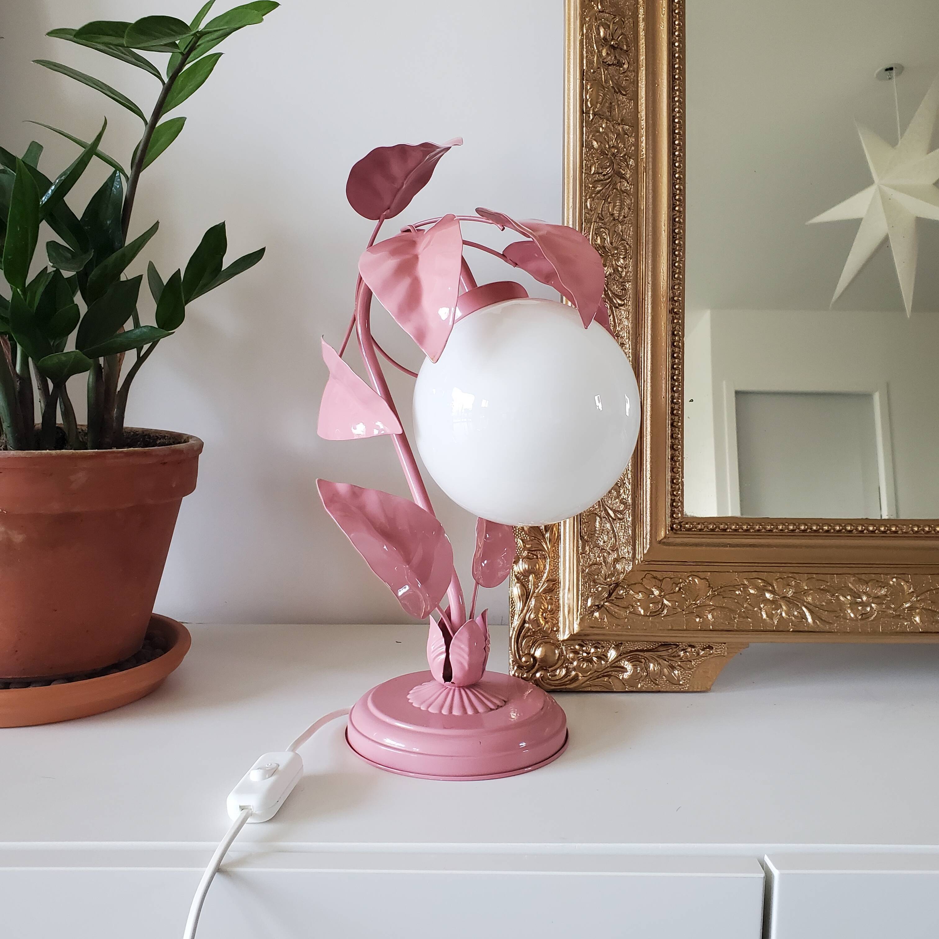 Opaline bedside lamp and pink leaves