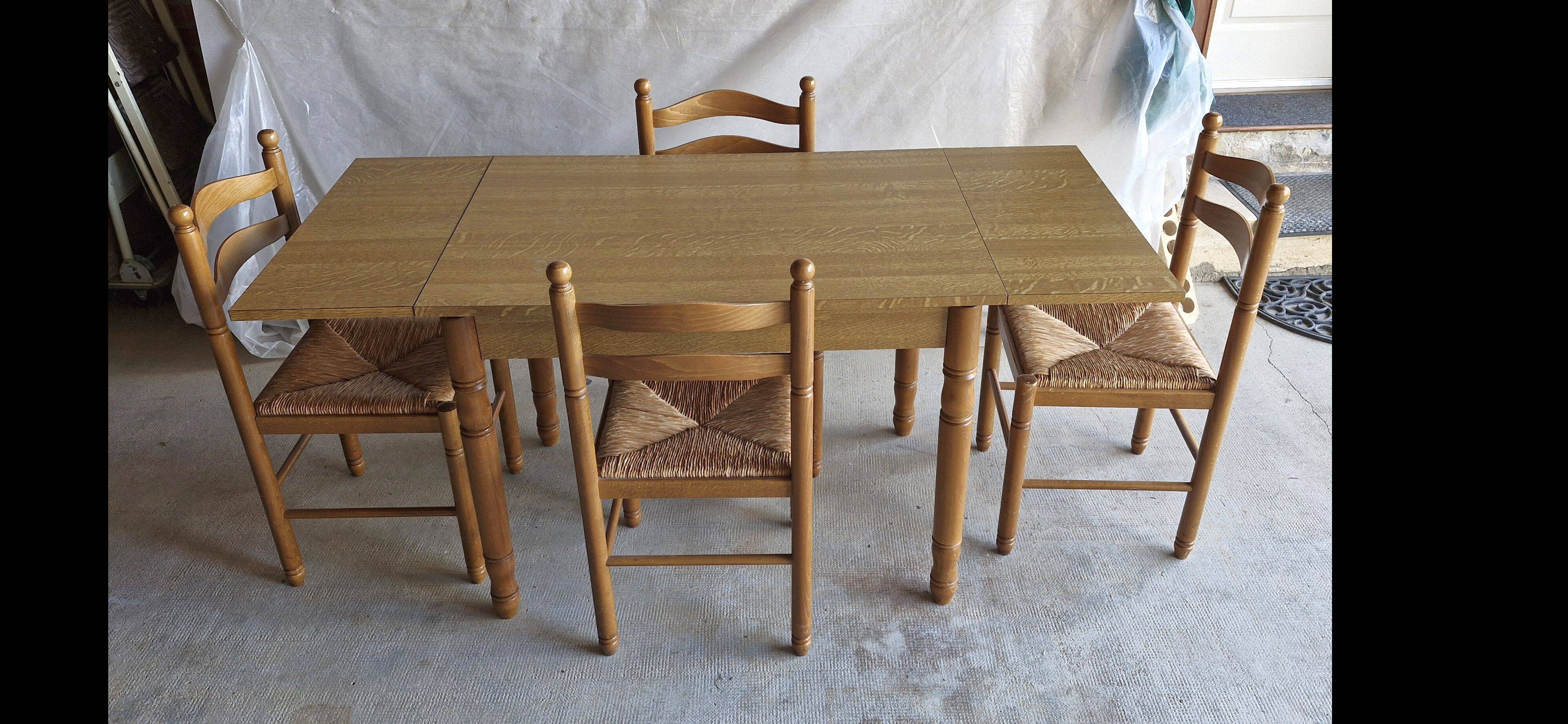 Wooden table with 2 extensions + 4 wooden chairs with rush seats