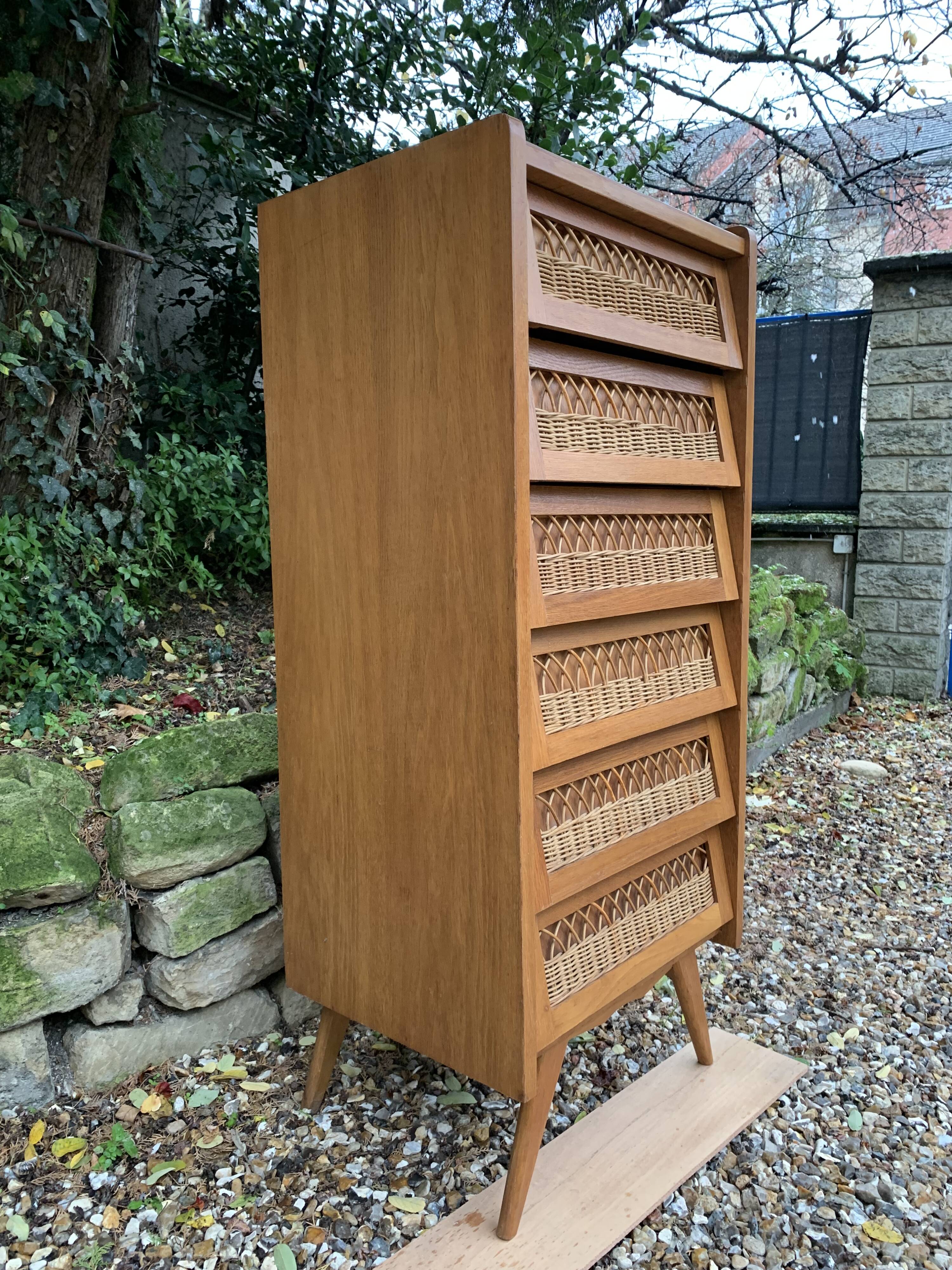 Vintage rattan chiffonier with compass feet 1950