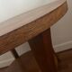 Low round art deco table in honey wood