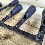 Brutalized wrought iron candle holder