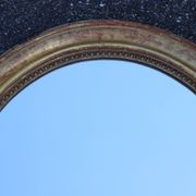 Paire de miroirs ovales en bois doré époque Louis Philippe