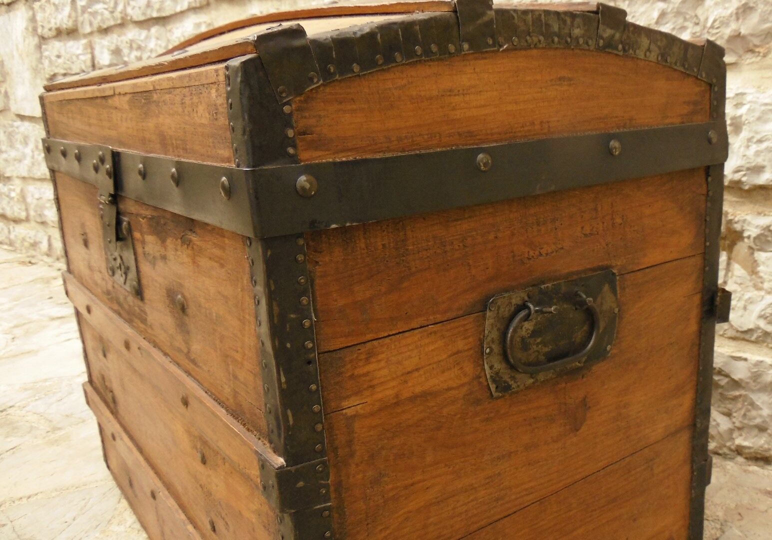 Ancient travel trunk, bulging wooden chest