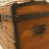 Ancient travel trunk, bulging wooden chest