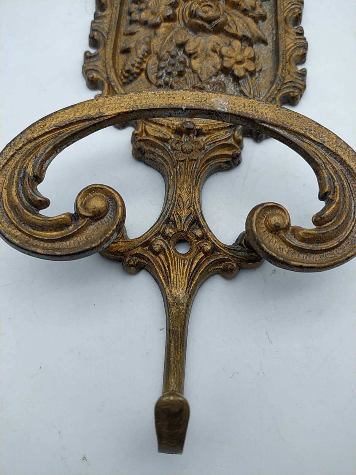 Brass coat rack with floral decoration