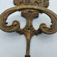 Brass coat rack with floral decoration