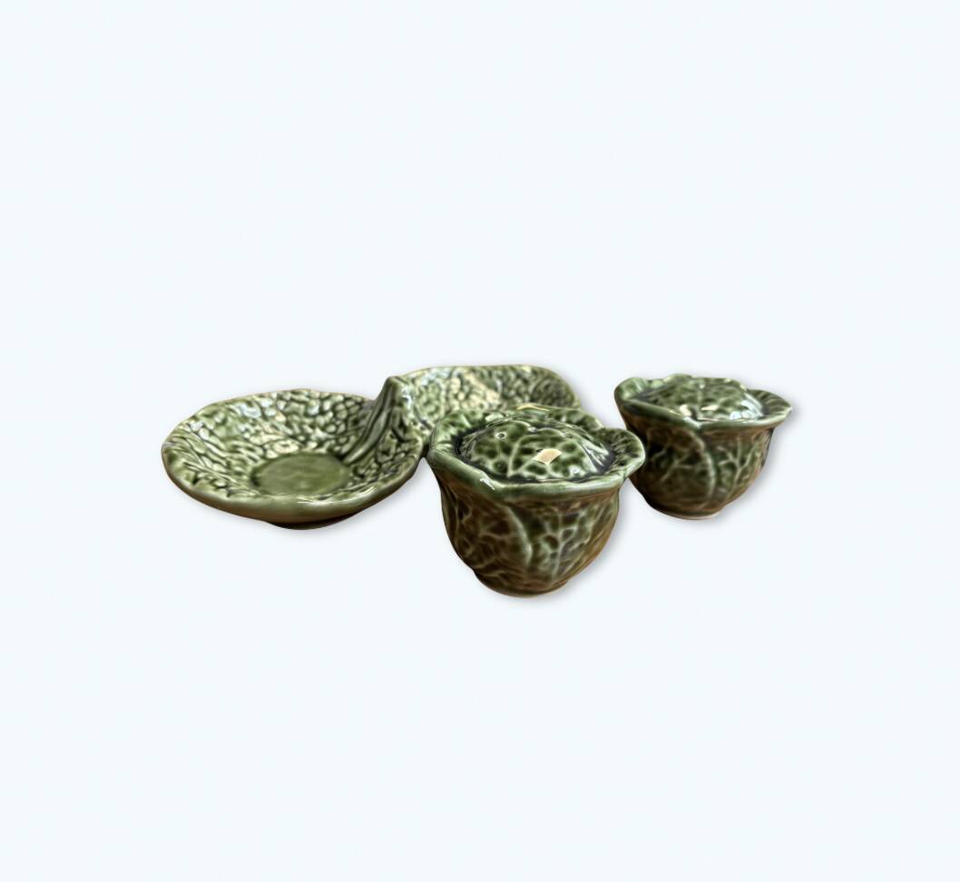 Salt and pepper shakers in the shape of a cabbage leaf.