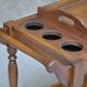 Serving table with a tray, on wheels, made of solid exotic wood.