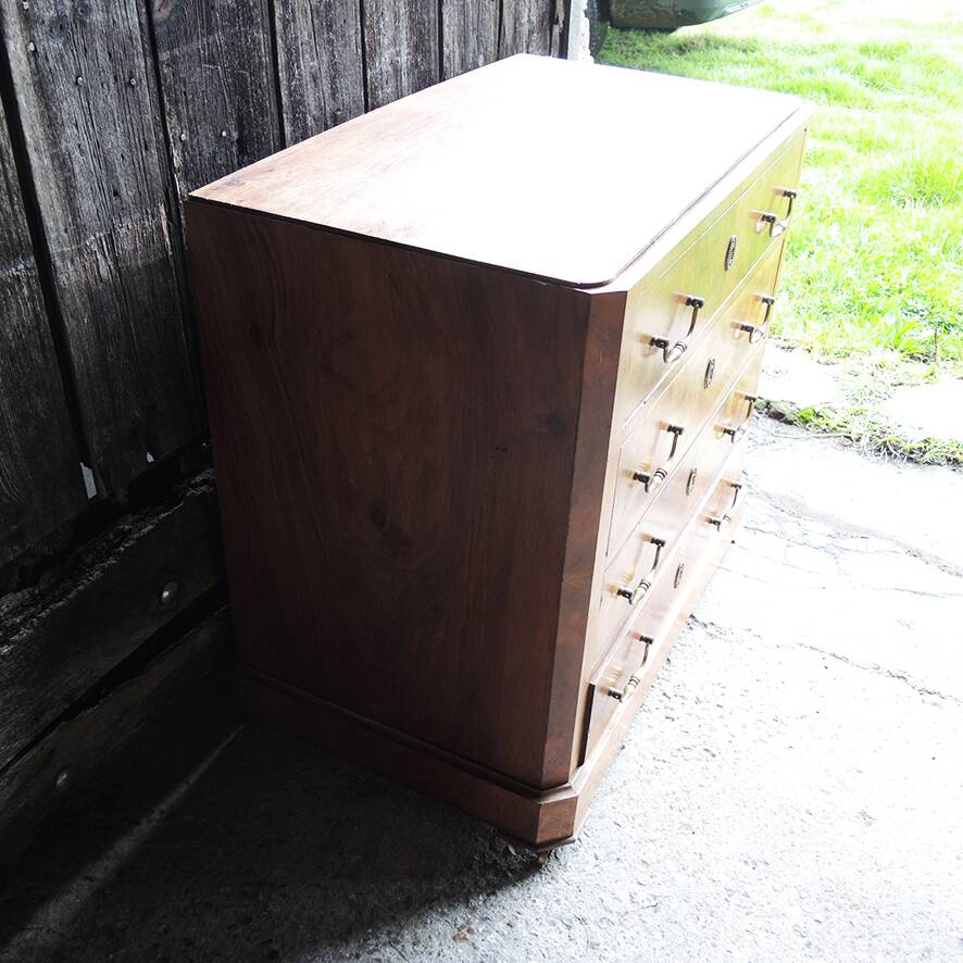 Old wooden chest of drawers with 4 drawers on wheels