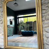 Antique mirror 136.5/98cm Louis-Philippe pearl-gilded with gold leaf.