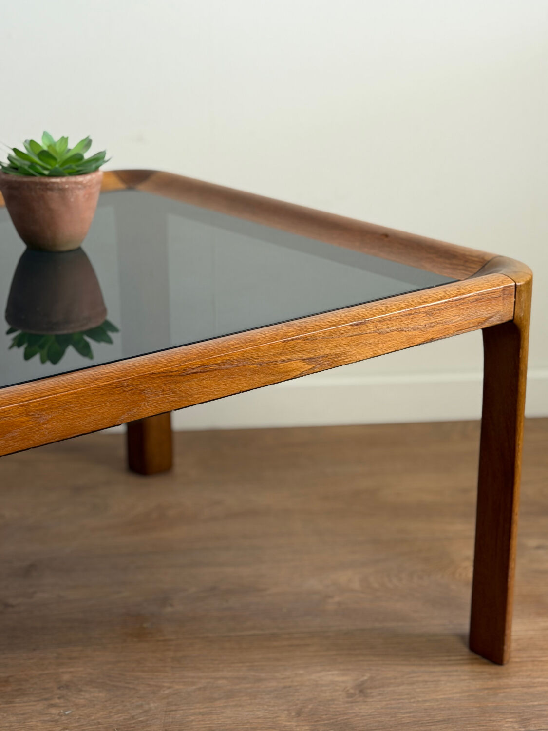 Large Scandinavian coffee table in teak and smoked glass.