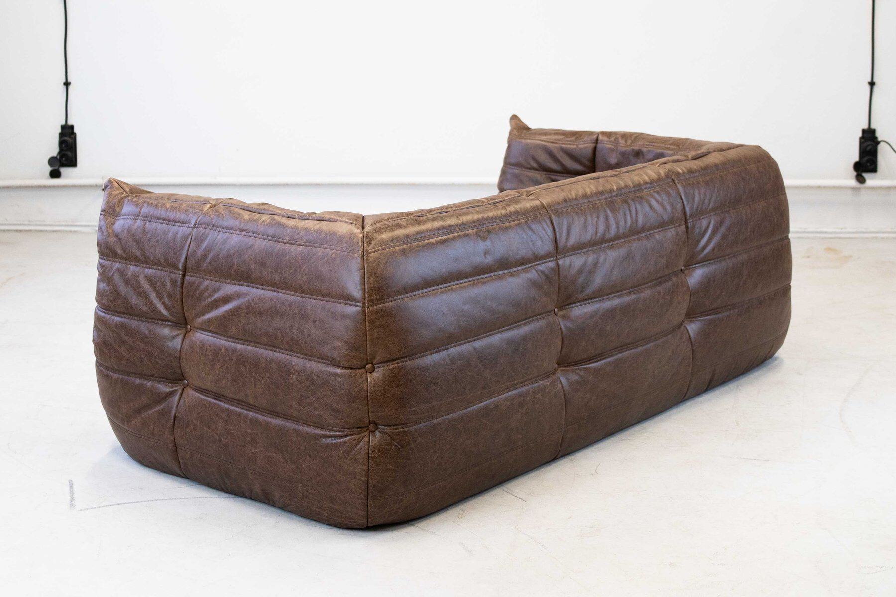 Vintage two-seater Togo sofa with arms in brown leather by Michel Ducaroy for Ligne Roset, 1970s