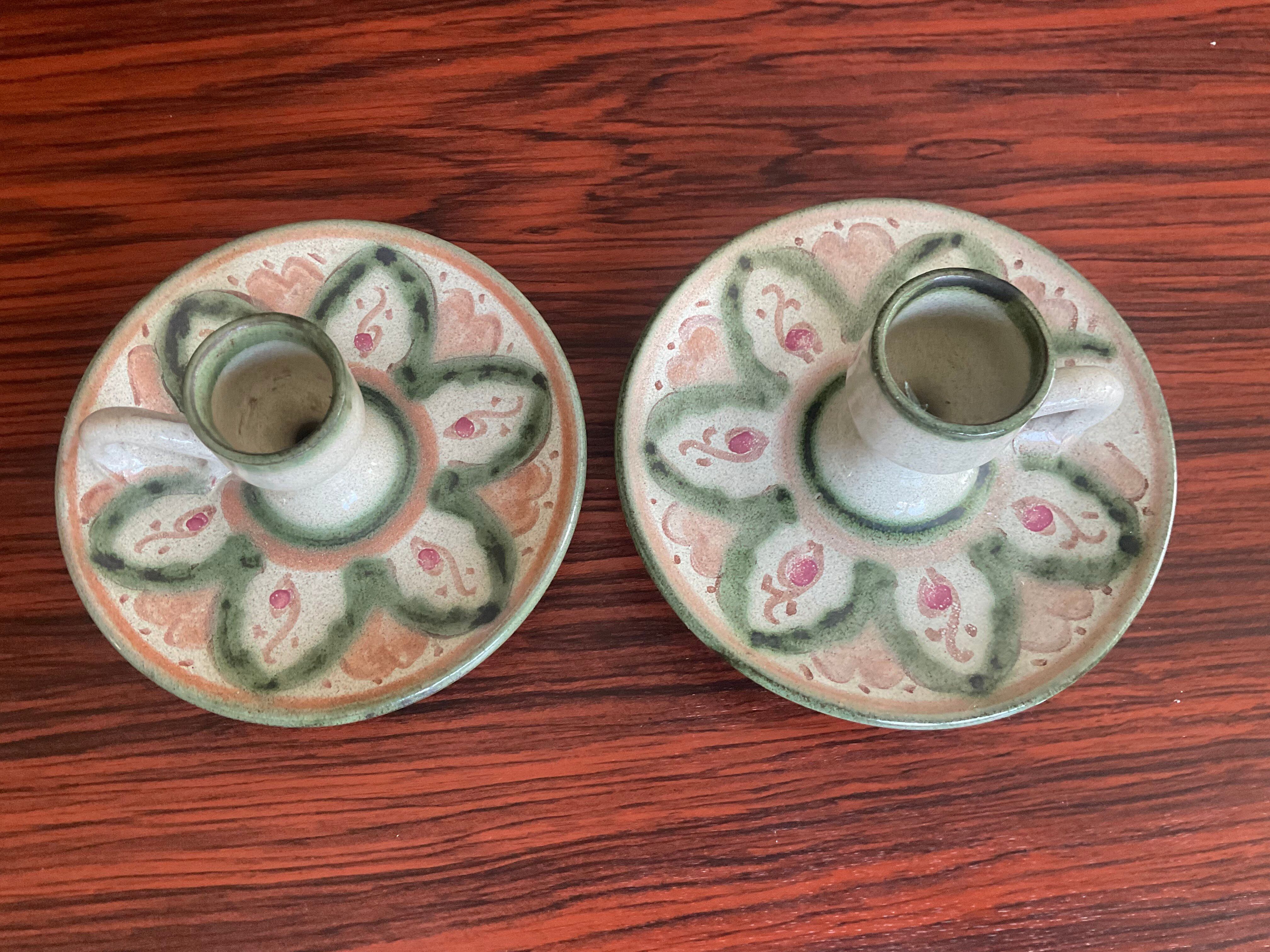 Pair of vintage cave rat candlesticks in glazed terracotta