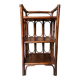 Dark brown 70s bamboo and cane shelf on legs