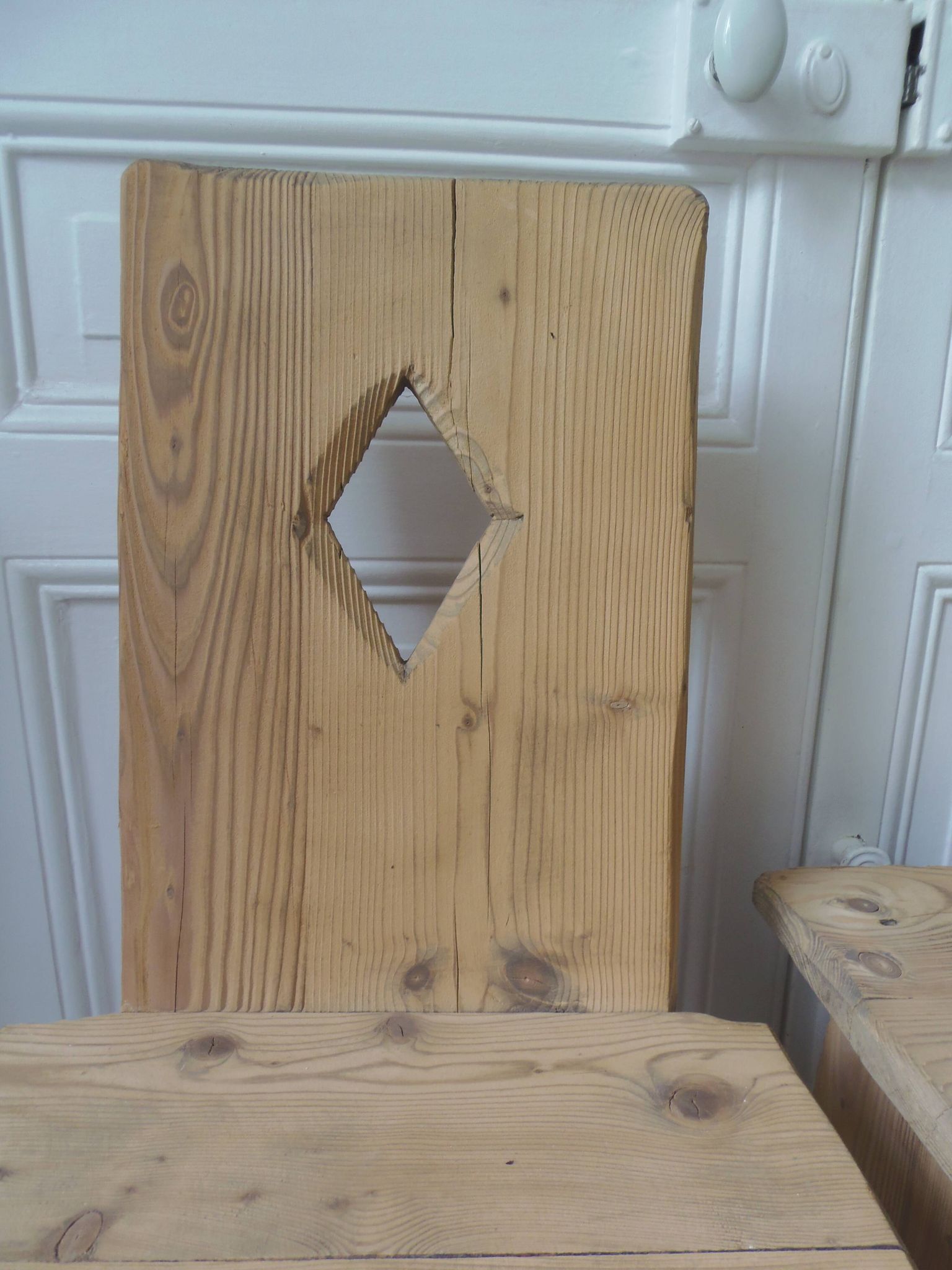 2 vintage chairs in brutalist style made of pitch pine with a waxed finish.