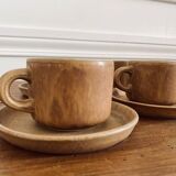 4 stoneware coffee cups and saucers
