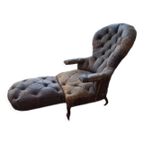 Chesterfield armchair with folding footrest