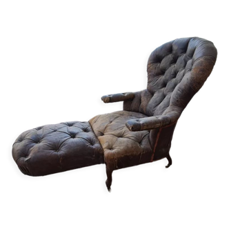 Chesterfield armchair with folding footrest