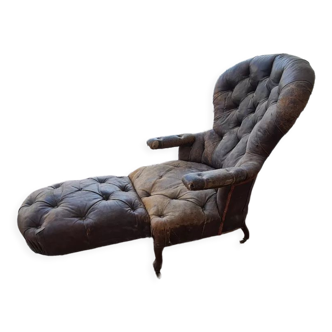 Chesterfield armchair with foldable footrest