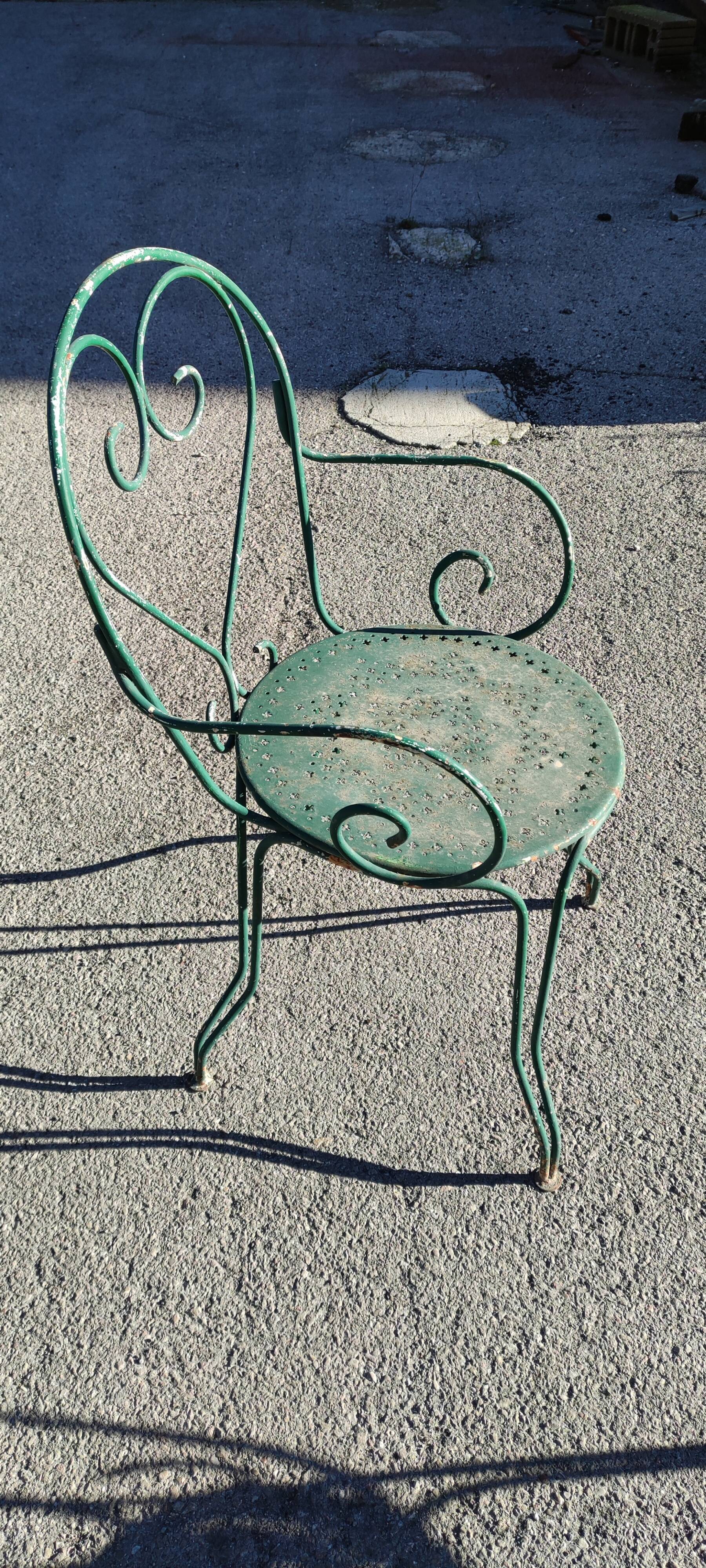 Garden table, two armchairs and a metal chair