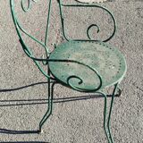 Garden table, two armchairs and a metal chair