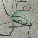 Garden table, two armchairs and a metal chair