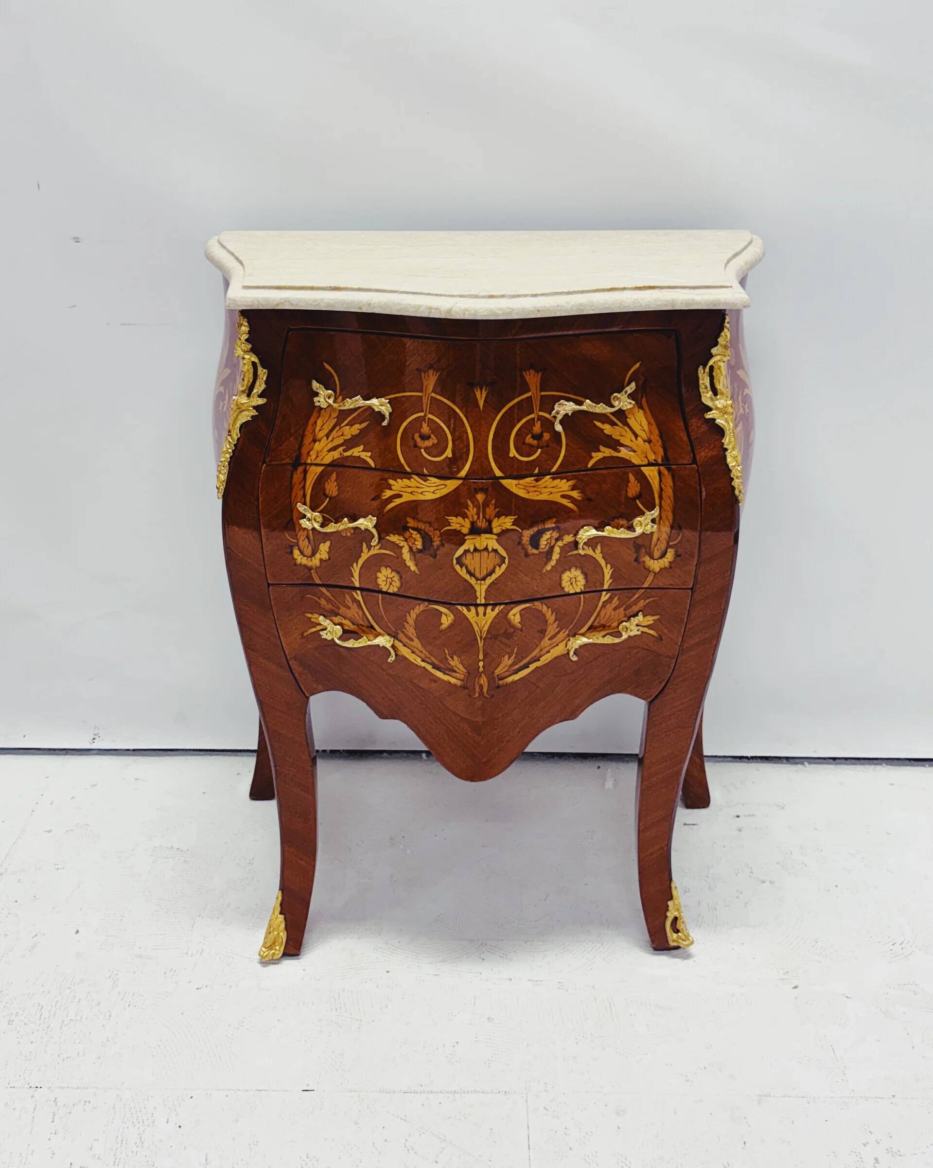 Marquetry chest of drawers with marble top in Louis XV style