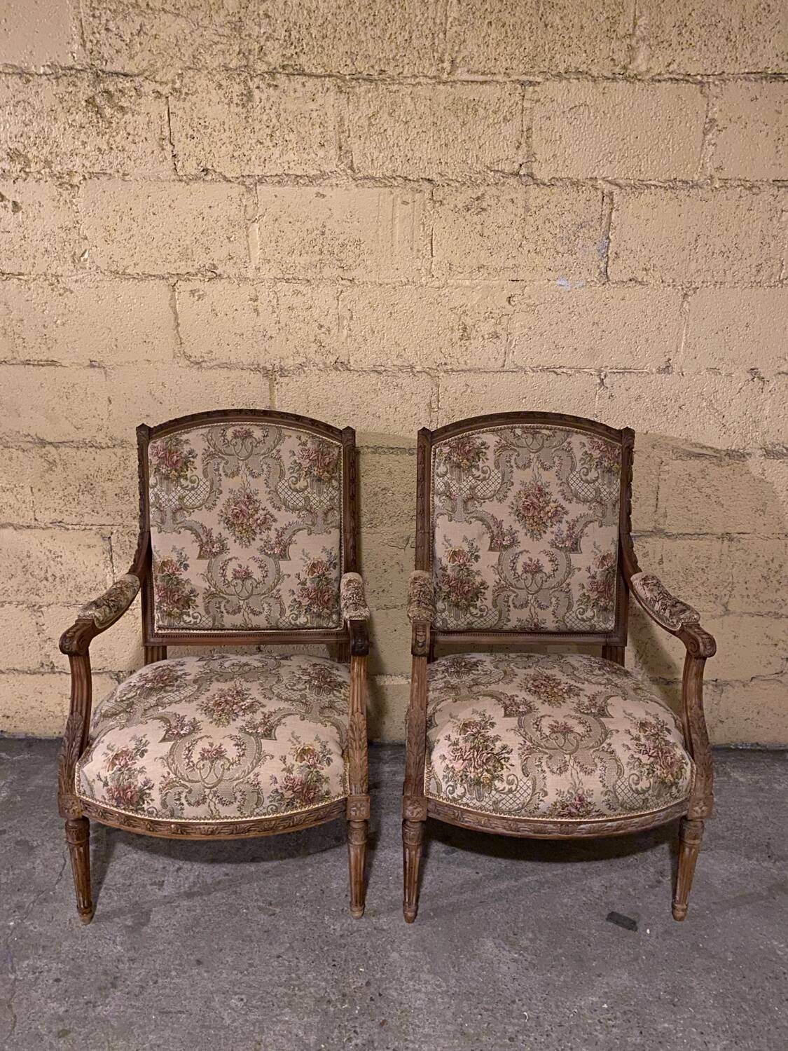Pair of antique carved wooden armchairs