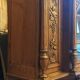 Art Nouveau buffet in carved oak with grapevine cluster decoration.