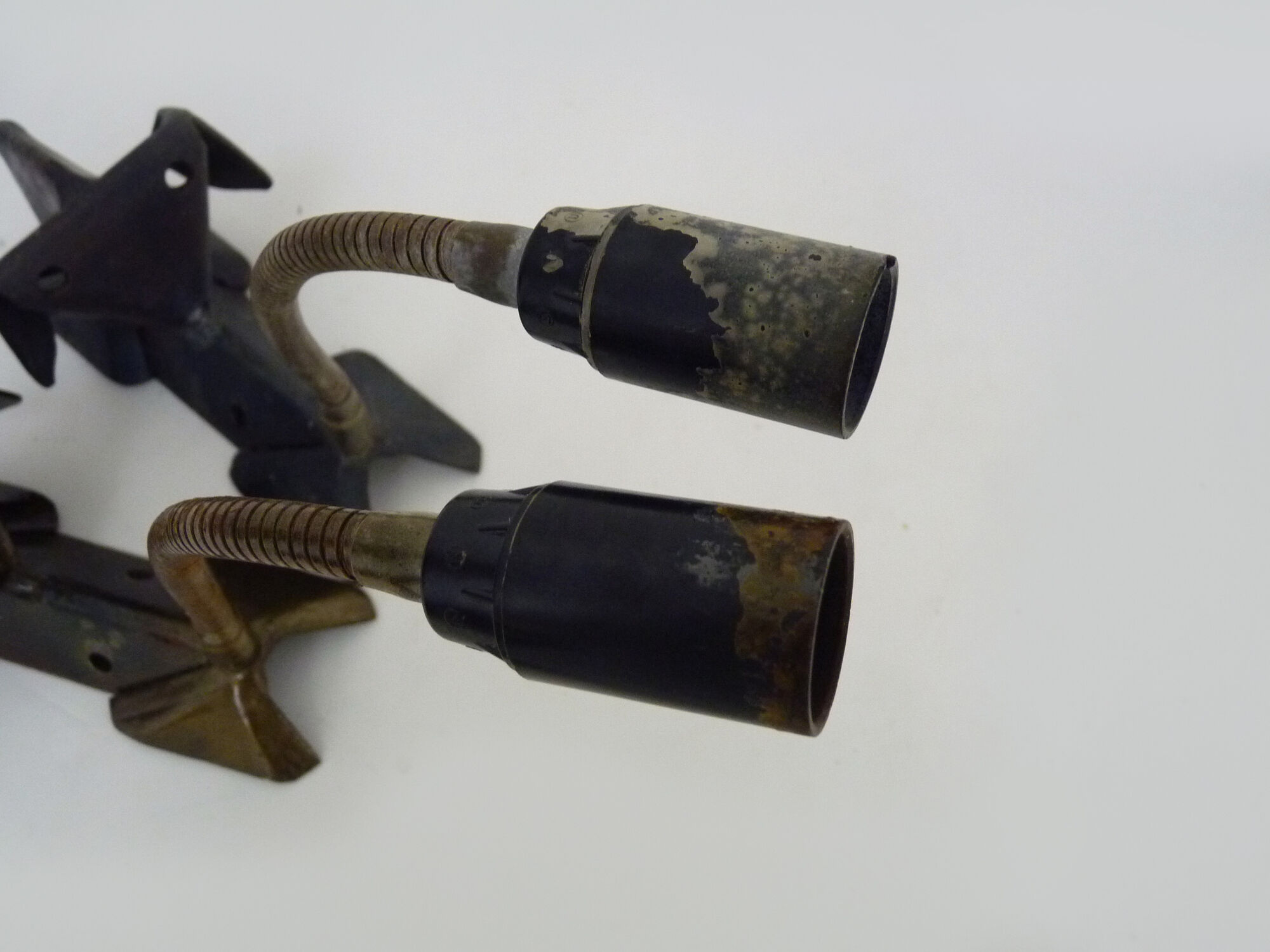 Pair of cast iron wall sconces with articulated arm, dog shape. Vintage