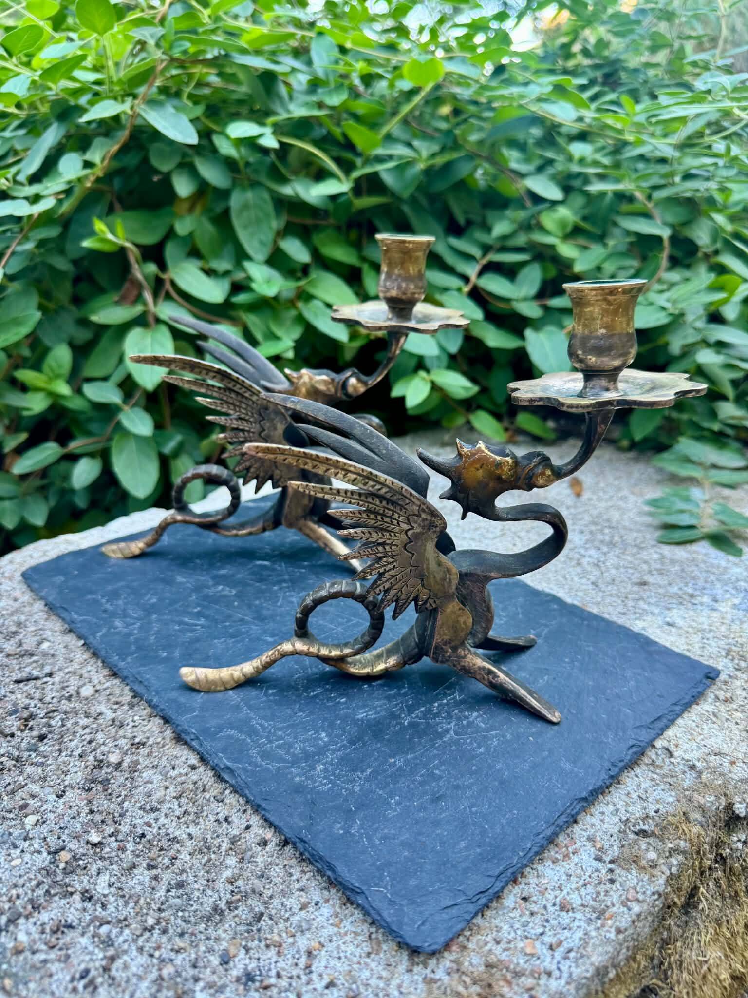 Pair of chimera candle holders in bronze, 19th century.