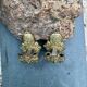 Pair of bronze wall sconces with mask, signed L. Pinet, Art Nouveau period.