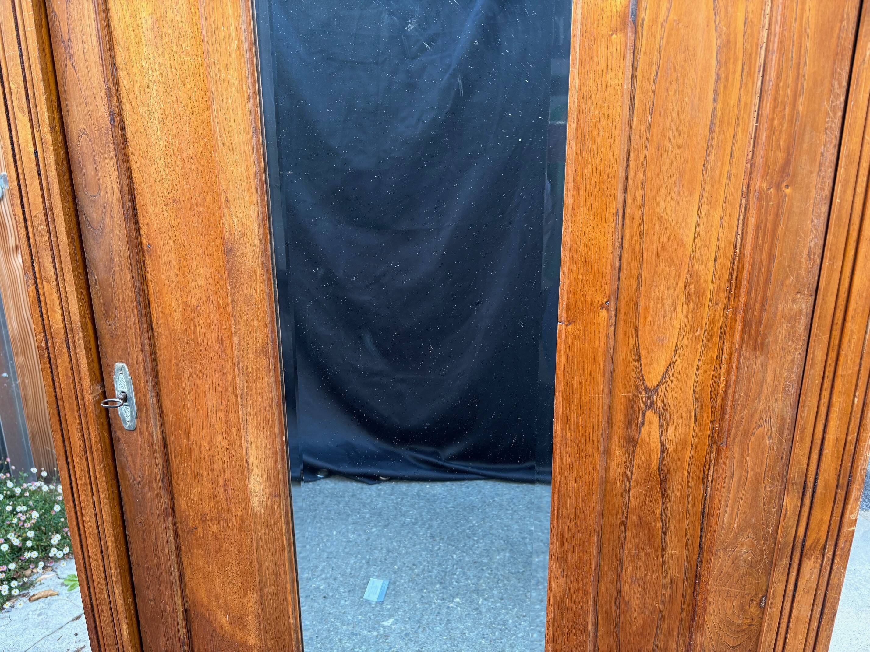 /Art Deco wardrobe with mirror in carved solid oak from the 20s/30s