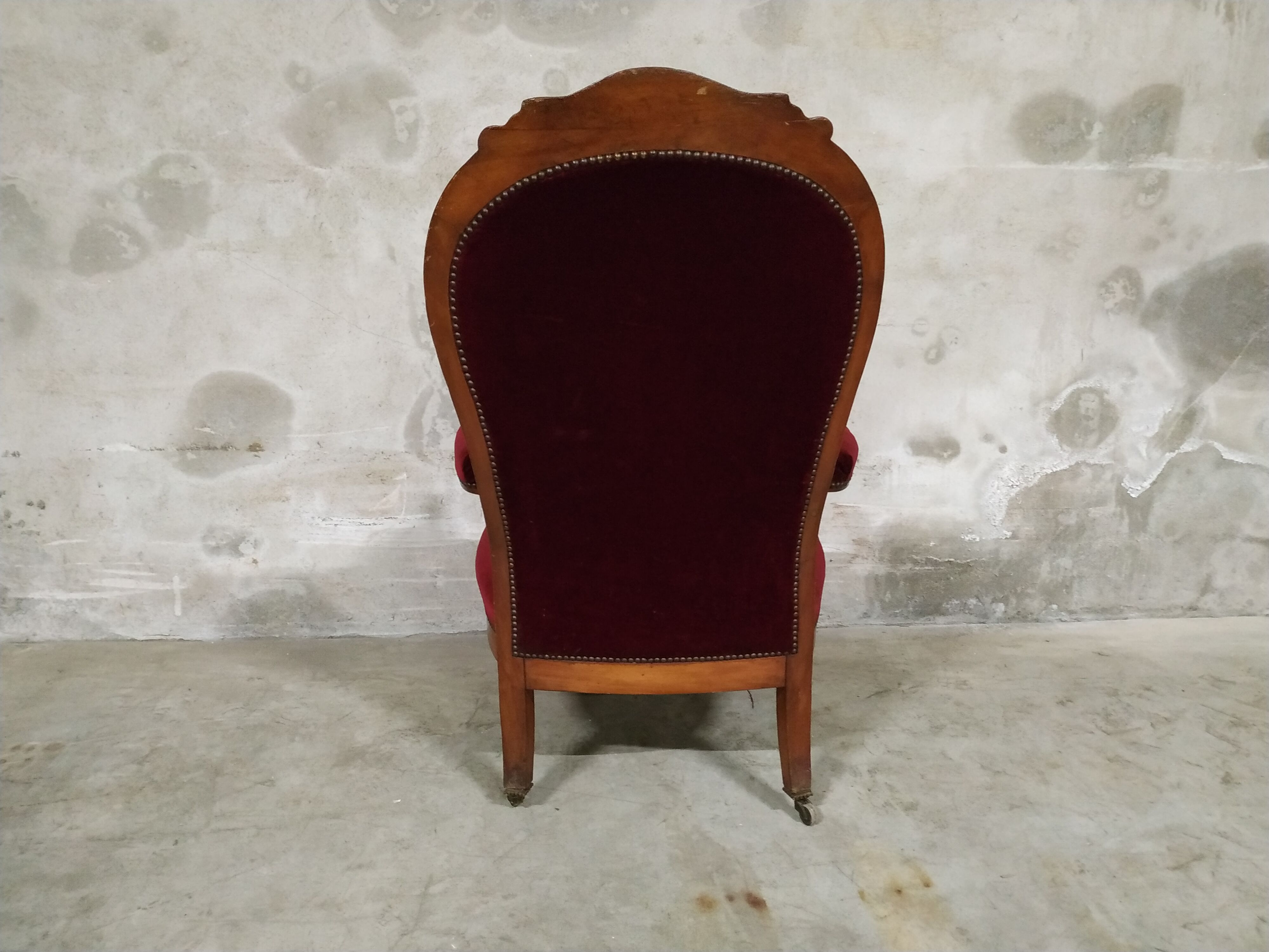 Walnut and velvet armchair