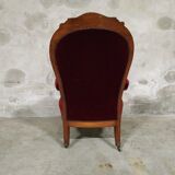 Walnut and velvet armchair