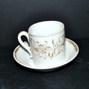 Paris porcelain coffee cup with floral design, antique porcelain with gold trim.
