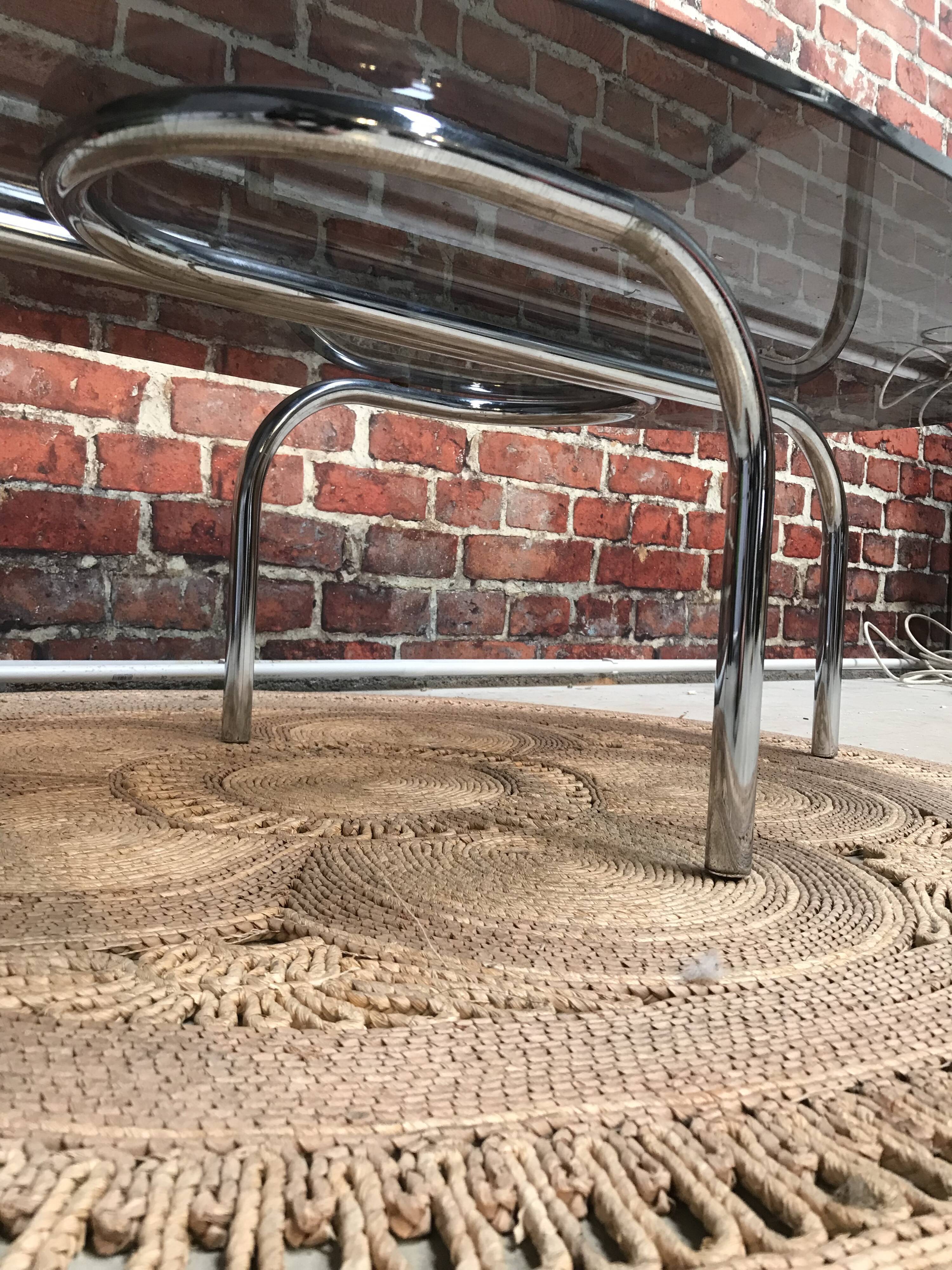 Vintage 70's oval coffee table in glass and chrome