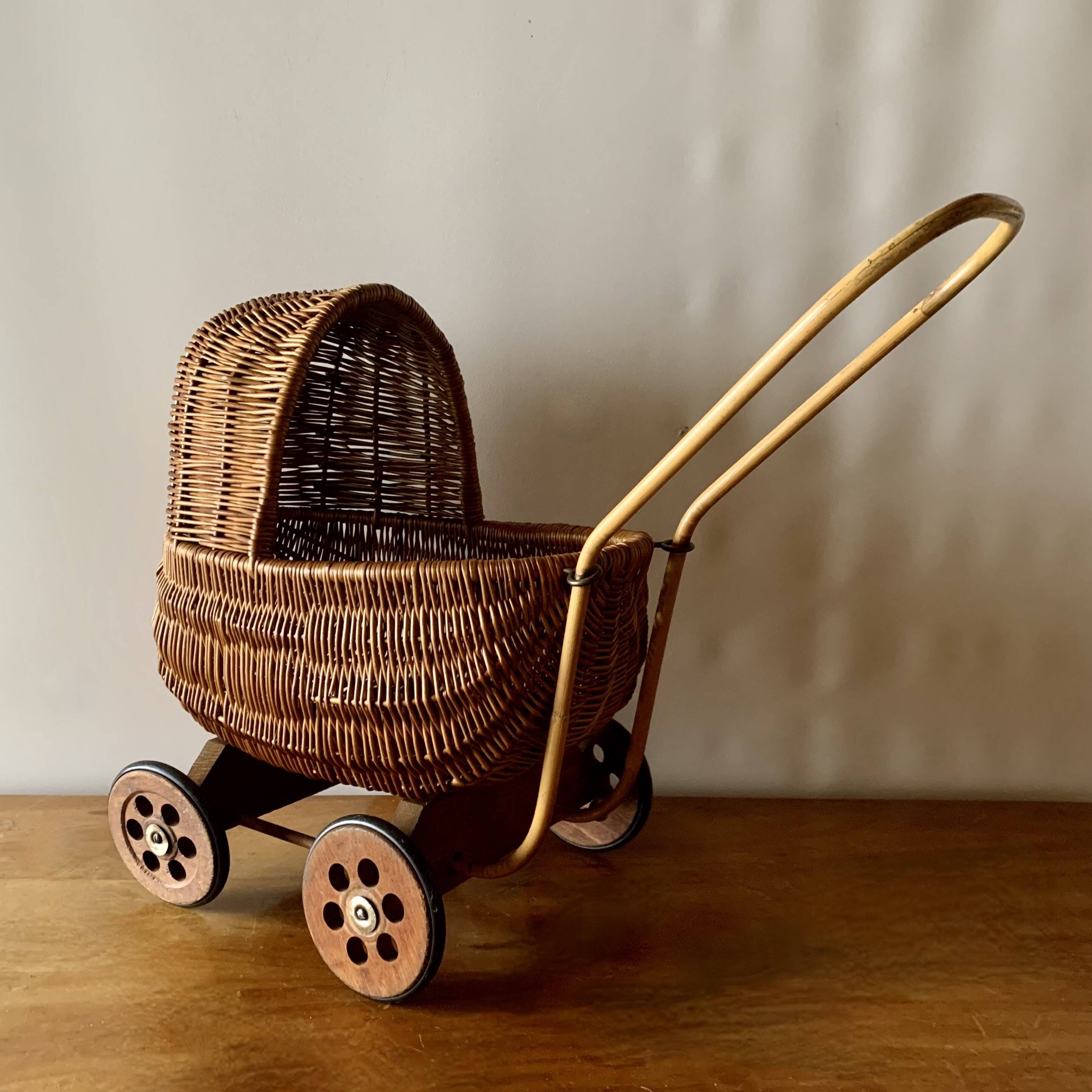 Old wicker dolls' pram - wooden wheels
