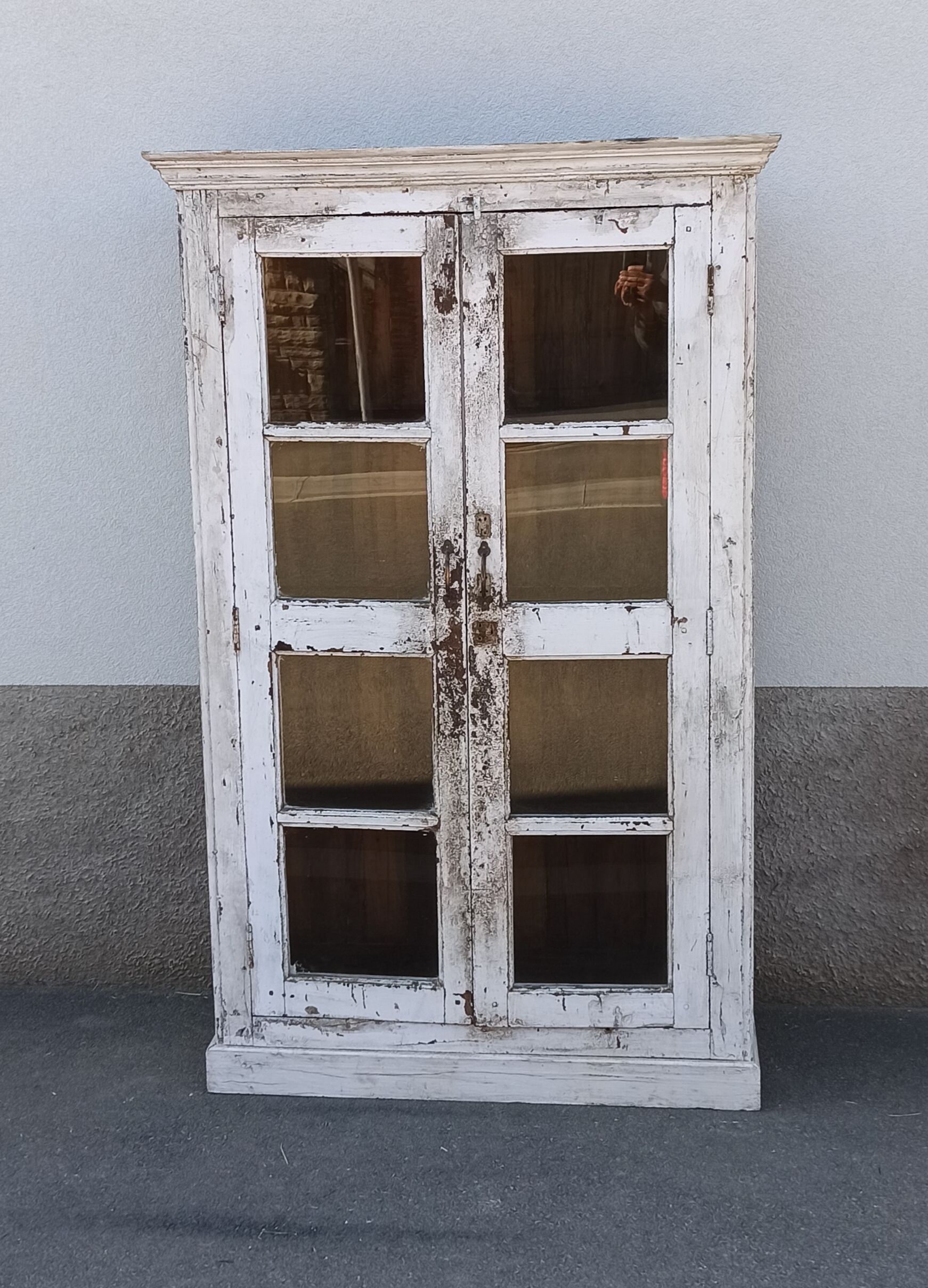 White wooden antique glazed wardrobe