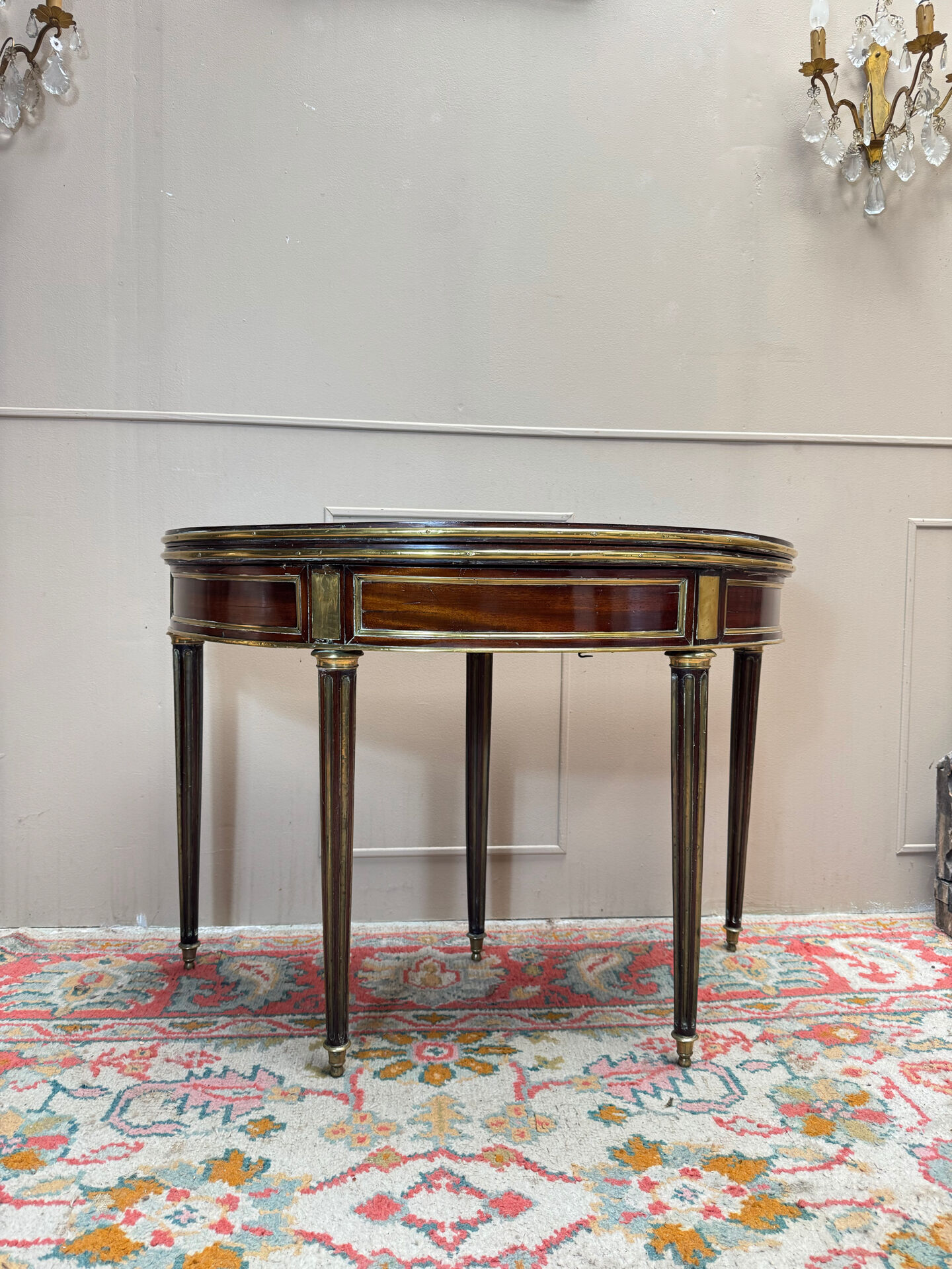 Half-moon table in mahogany from the Louis XVI period, 18th century.
