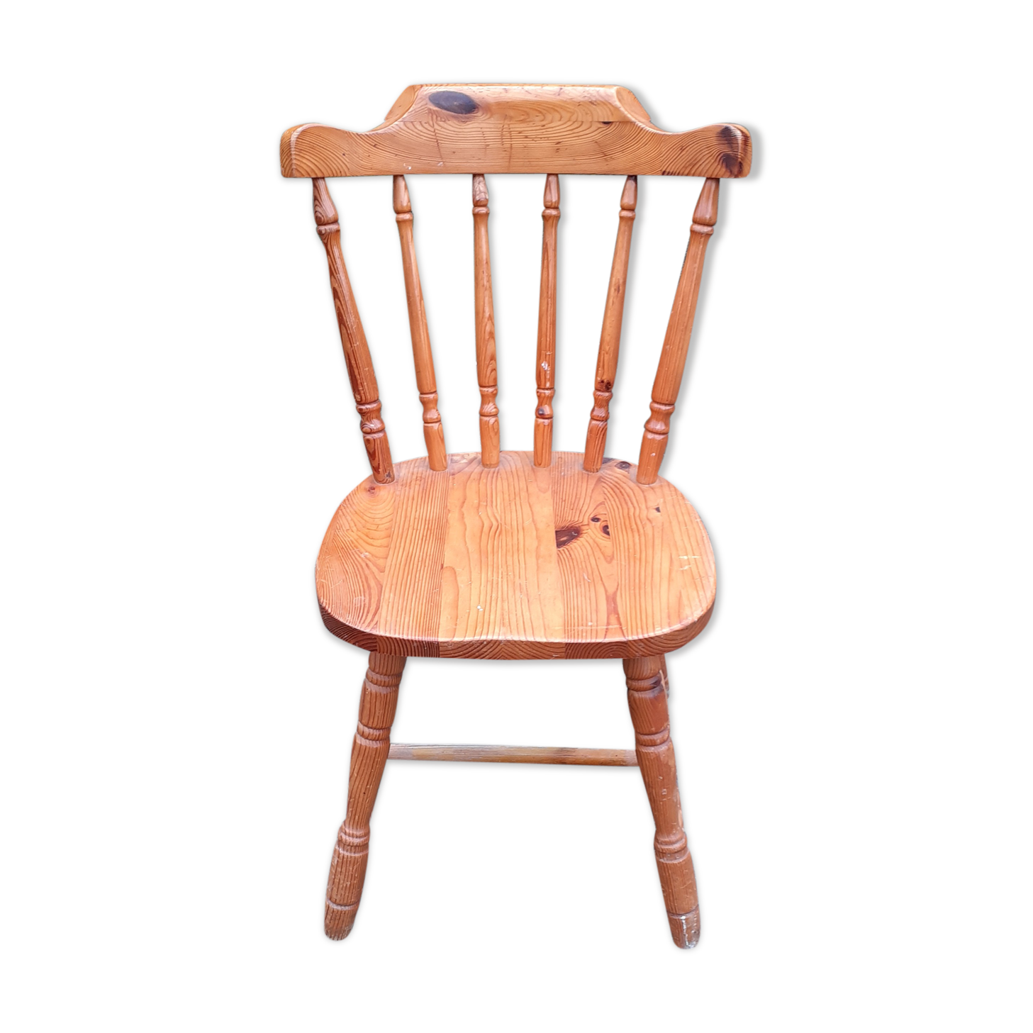Light-coloured wooden american armchair