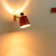 Old and rare Stilnovo wall light, red and black lacquered metal and brass With period label