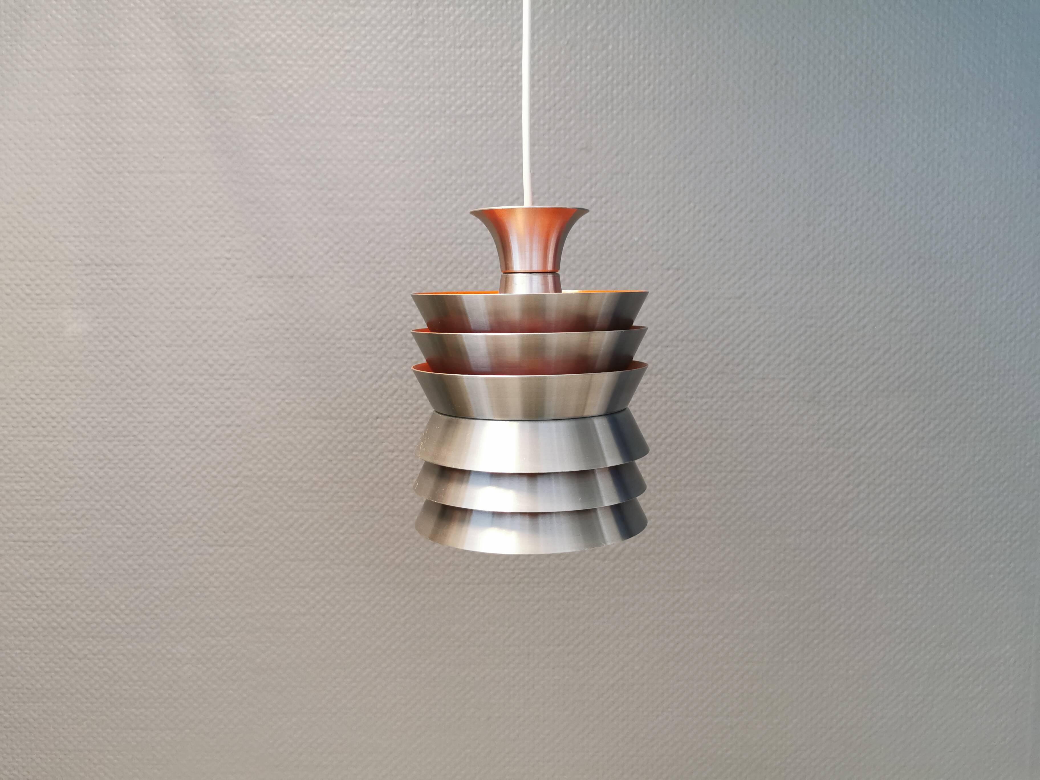 Danish/Swedish hanging lamp, in silver-coloured aluminium with orange interior paint.