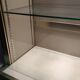 Ivory-colored and matte gold anodized aluminum display bookcase