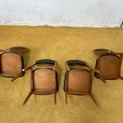 4 Scandinavian chairs in teak and black faux leather.