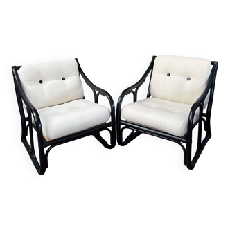Set of two vintage black and white bamboo chairs.