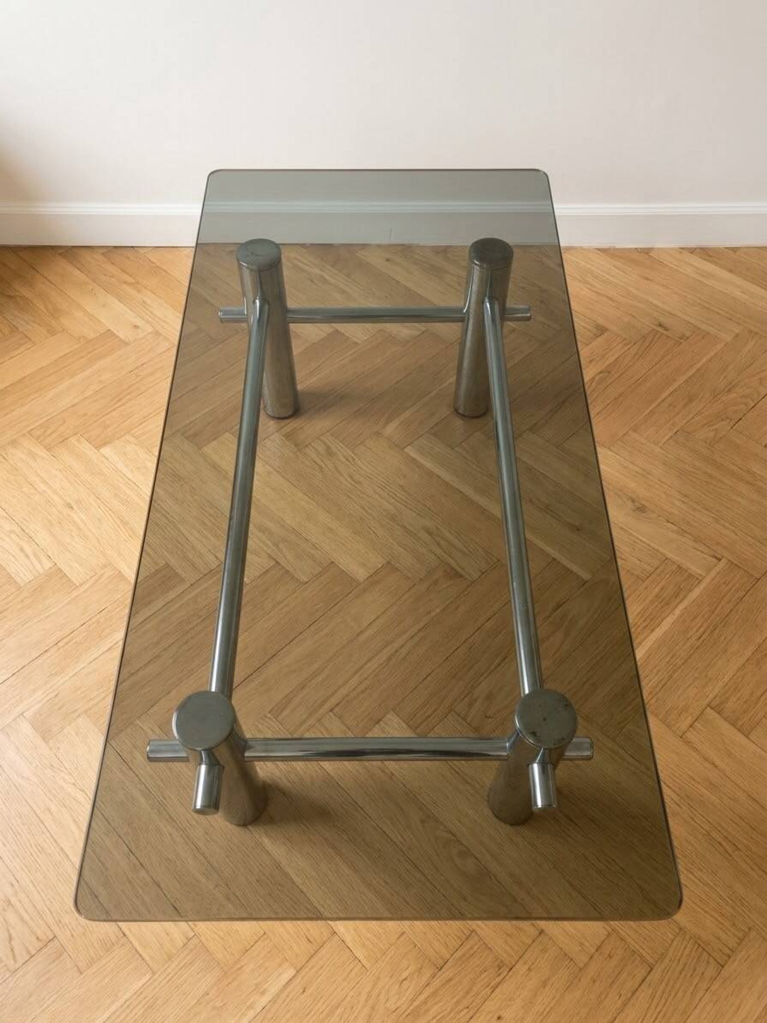 Vintage 1970s coffee table in smoked glass and chrome metal.